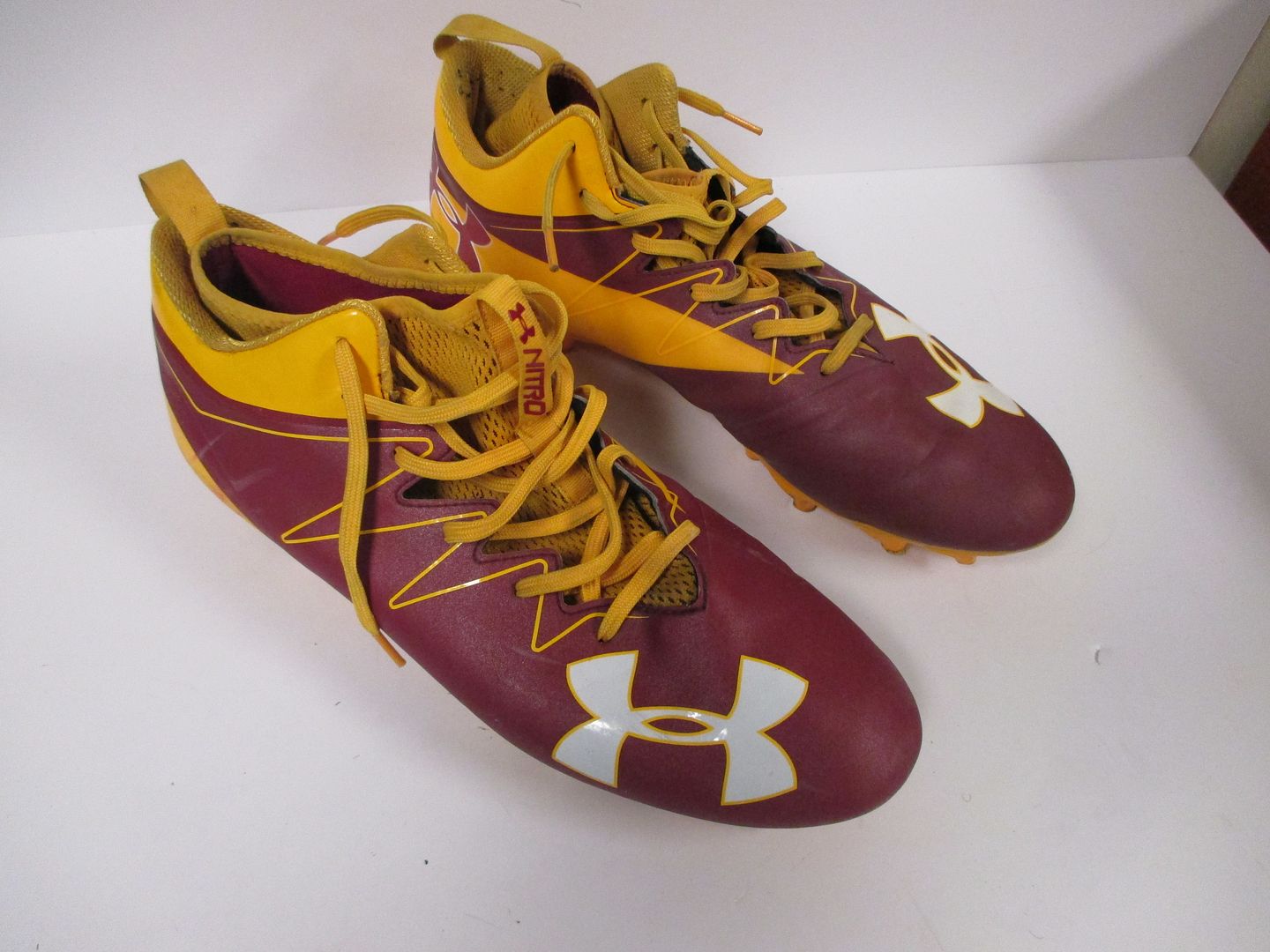 maroon under armour football cleats