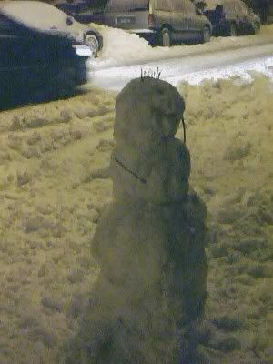 A lonely snowman braves the storm